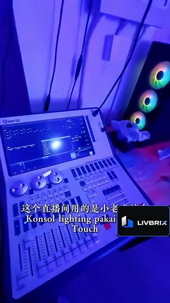 Lighting control console and computing equipment in the studio.